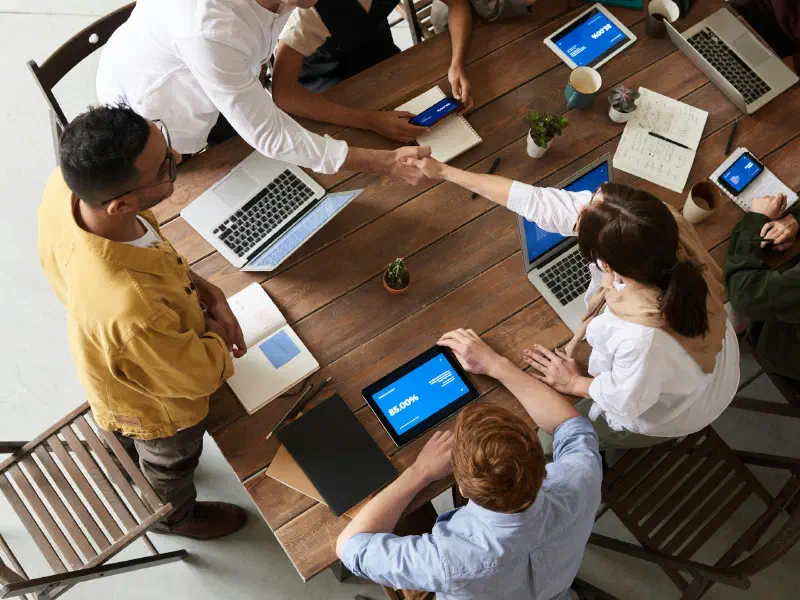 High angle shot of a diverse group of professionals collaborating around a table